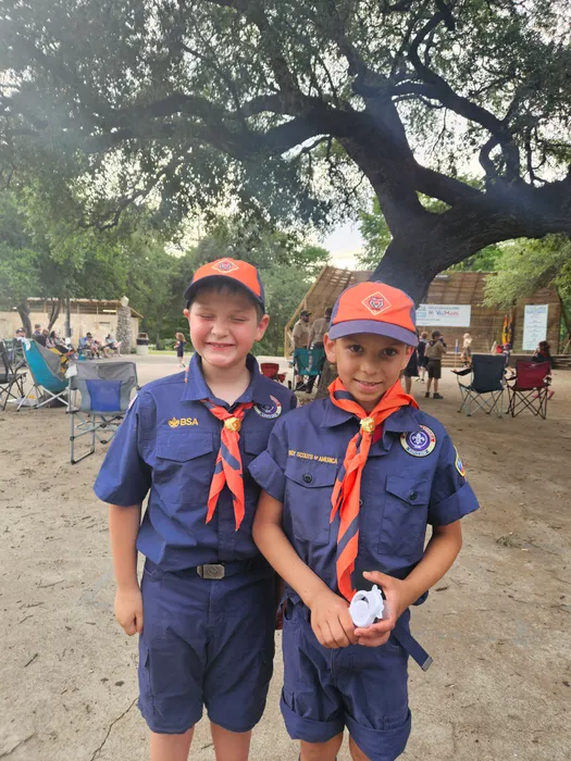 Wyatt and a fellow Scout in uniform beneath a tree